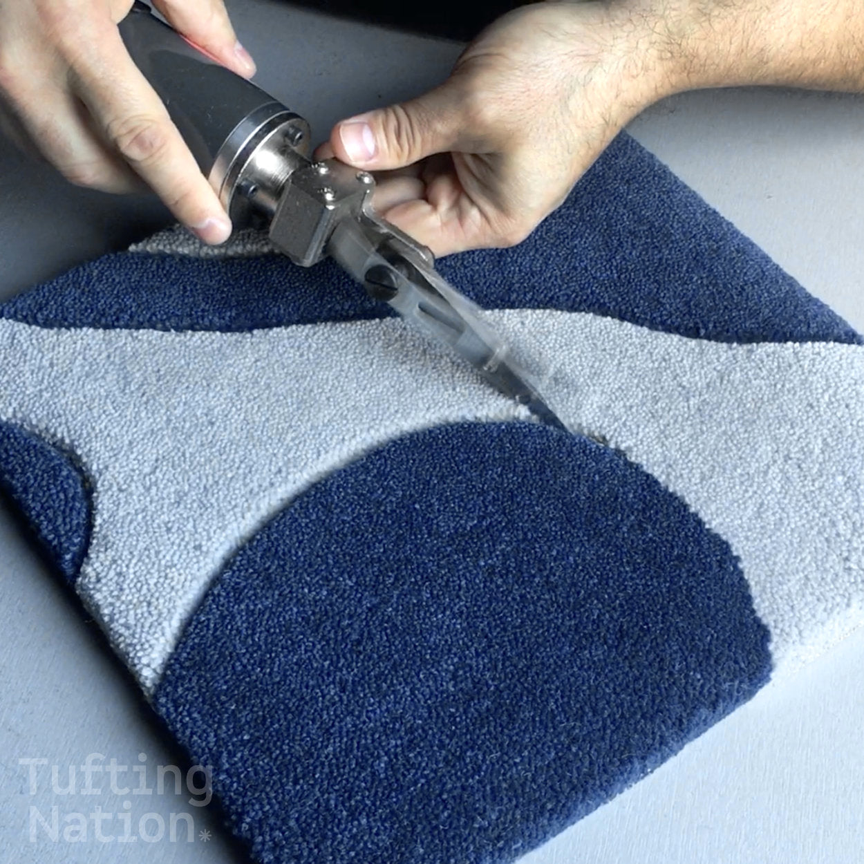 Rug Carving Scissors in action over a handmade tufted rug
