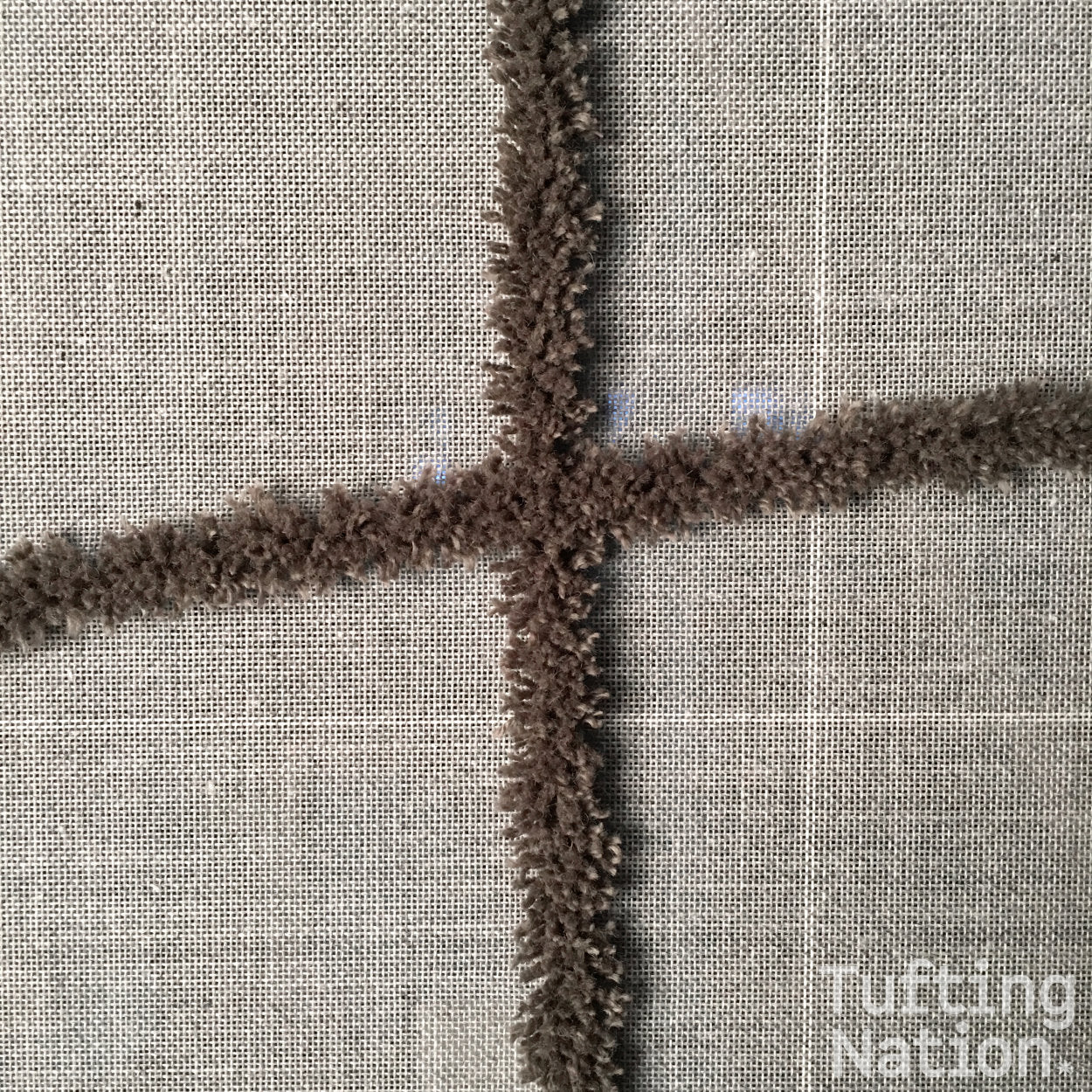 Rug Yarn tufted on a gray tufting cloth | TuftingNation