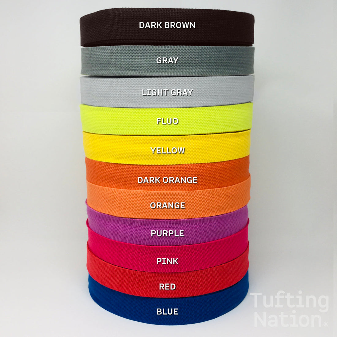 Pile of colorful binding tape for carpet finishing. 1.5 inch wide, 100% cotton twill tape at TuftingNation.